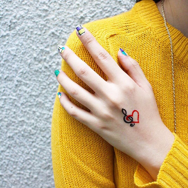 heart-and-music-note-connected-temporary-tattoo-design-for-hand - 20 Cool Temporary Tattoos You Love to Get